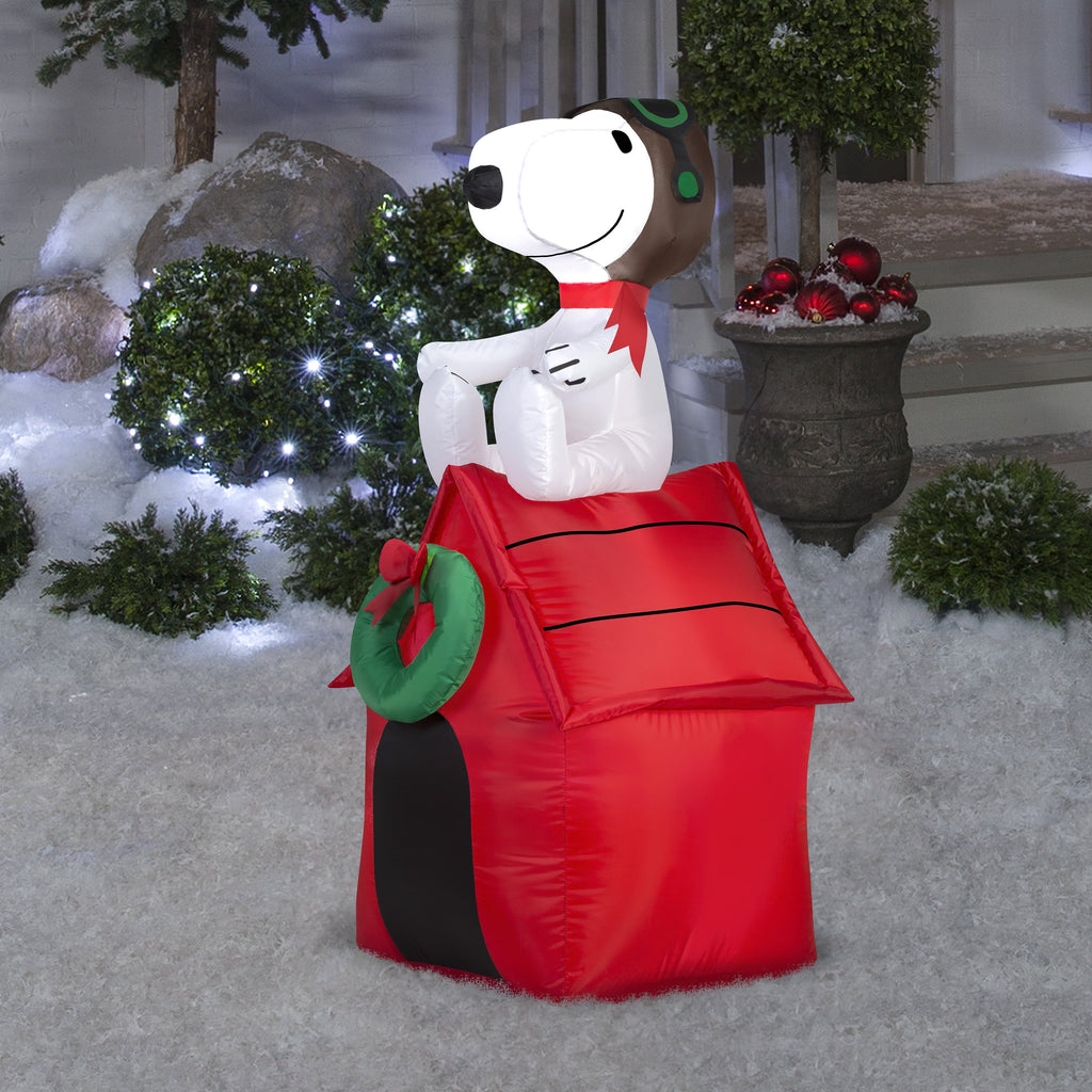 42" Airblown® Inflatable Peanuts® Christmas Snoopy Flying Ace on Doghouse Outdoor Yard Decoration